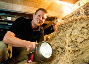 A Home&dry assessor looking for underfloor insulation.