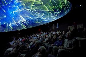 Guests enjoying the experience at the Sir Edmund Hilary Alpine Centre theatre at Aoraki Mount Cook.