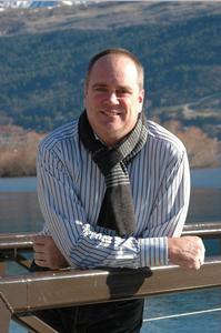 Ray White salesperson Cameron Reed enjoys the sunshine at Kawarau Village.