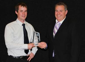Andrew Rae of Southern Landmarx being presented with his award by Adam Pollard.