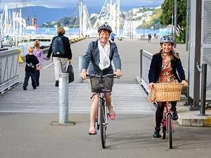 Mayor Celia Wade-Brown and comedian Sarah Harpur demonstrate the 'friendly cyclist' riding style. 