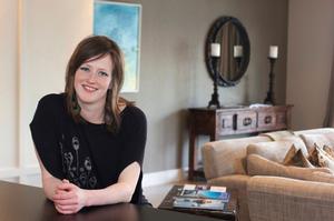 Eichardt's chef de partie and artist Kathryn Pender at The Residence, Queenstown, with her artwork 'Milford Deep' in the background.