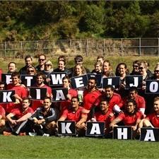The All Blacks and NZRU staff hold up a get well message for Jonah Lomu