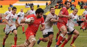 Viktor Kolelishvili scored one of Georgia's tries as they beat Russia to move top of the Division 1A standings. 
