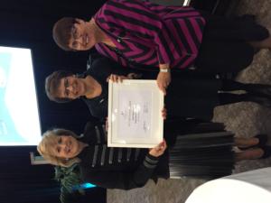 Janet Kingsbury (ctr) receives her award