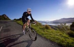 Hayden Roulston trains on part of the route Le Race will take on Saturday, the Summit Road, high above Lyttelton Harbour 