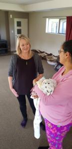 Community based midwife Bex Tidball with new mum, Valentina with Tomas, born during Level 4 lockdown