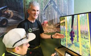 Swedish forestry tutor Anders &#214;berg shows student Bradley Solomon, 18, new functions on one of Toi Ohomai's harvesting simulators. Bradley is taking a three-month course in Basic Machine Operation before returning to his harvesting crew in Gisborne.