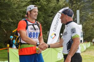 Richie McCaw is welcomed at the finish of the Coast to Coast mountain run by Kathmandu Coast to Coast nine time winner and ambassador Steve Gurney. 