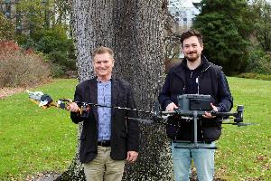 Professor Richard Green and Dr Sam Schofield with the new chainsaw drone they've developed as part of the UC Vision research team project. 
