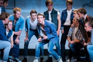 Riff (Angus Mossman) surrounded by his gang of Jets