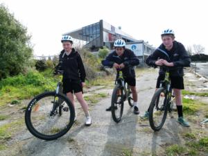 Three of the six Aranui High School students in with the opportunity to compete in the Coast to Coast next year alongside some legends of New Zealand multi-sport, Mikayla Scott, Taitama Tukaki and Andrew Gordon, with their new Giant Mountain bikes.
