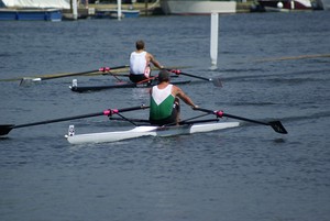 Wairau sculler Duncan Grant (green) leads the reigning Diamond Sculls champion Ian Lawson on his way to victory in his first round race today