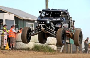 Karl Fenton leaps to victory in heat one at Makarau