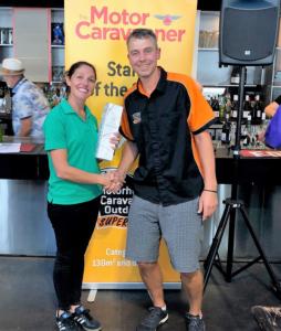 Julie French from RV Super Centre accepts the winner of large stand of the year award at the Covi SuperShow