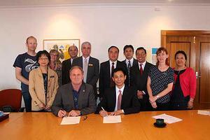 Caption: Professor Chris Moore (seated front row) and Guangzhou Medical University's Vice-President Professor Wei Donghai sign memorandum of understanding. Back row: Professor Harald van Heerde (Massey), Jean Lim (Massey), Dr Sandy Bulmer (Massey), Dr Lu Jiachun (GMU), Associate Professor Russell Gregory-Allen (Massey), Mr Chang Qing (GMU Vice-President), Professor Liu Jun Rong (GMU), Deputy Director General Hu Bingjie (GMU), Sandra Mohl-de-Vallejo (Massey), Professor Zhou Ying (GMU).