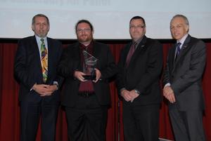 Coastguard Canterbury volunteer Andrew McGregor is presented with the Coastguard Air Patrol Volunteer of the Year Award 