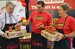 Steve Anderson, Managing Director Foodstuffs New Zealand, former All Black captain Buck Shelford and Pierre van Heerden, general manager, Sanitarium, juggle some jars of Marmite at New World Northwood, Christchurch, this morning.