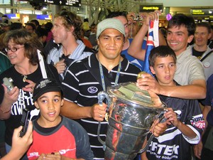 Jerome Ropati with fans and the cup