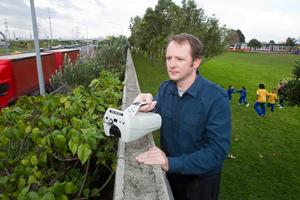 Dr Ian Longley records air samples