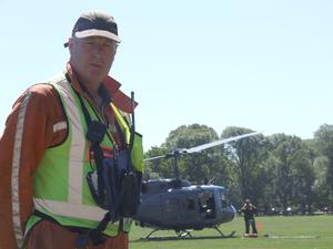 Department of Conservation's Shane Cross is the Hagley Park "lollipop man", co-ordinating helicopter movements in and out the central city emergency response air base.  