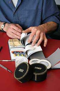 Industrial Design lecturer Matthijs Siljee sorts  some of the contents for the time capsule.