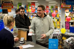 The world's first copy of Windows 8 being sold to Greg Daniel