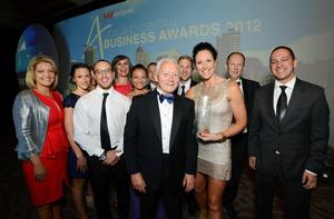 Auckland Chamber of Commerce chief executive Michael Barnett congratulates the team from Les Mills International &#8211; winners of the Westpac Supreme Business Excellence Award. 