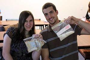 Massey students Rebecca Butler and Grant Weherley with their food for the day.