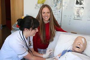 Bachelor of Nursing second year student Samantha Dennis, at left, with Jessica McIvor who has devised a manual to ease the anxiety of getting a jab for needle phobic people.