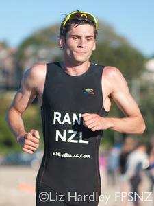 Race winner Cooper Rand crossing the finish line.