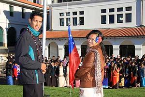 Samoan secondary school students raise the Samoan flag to celebrate Independence Day at the Albany campus.