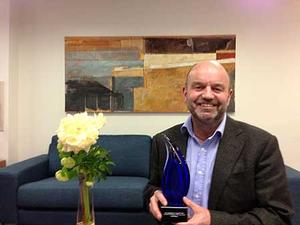 Massey University mediation teacher Geoff Sharp with his Mediator of the Year award.