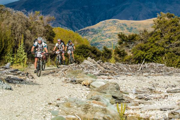 Team mountain biking beside Lake Wakatipu 2015 GODZone