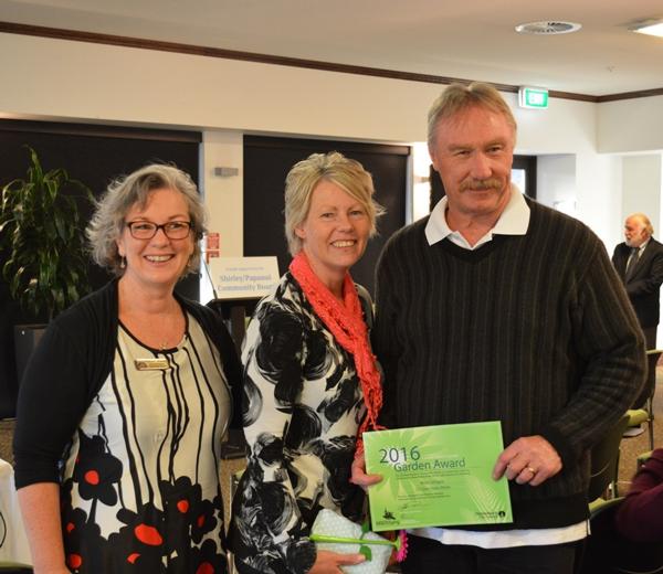 Community Board Member Barbara Watson and winners Mike and Karen Gilligan