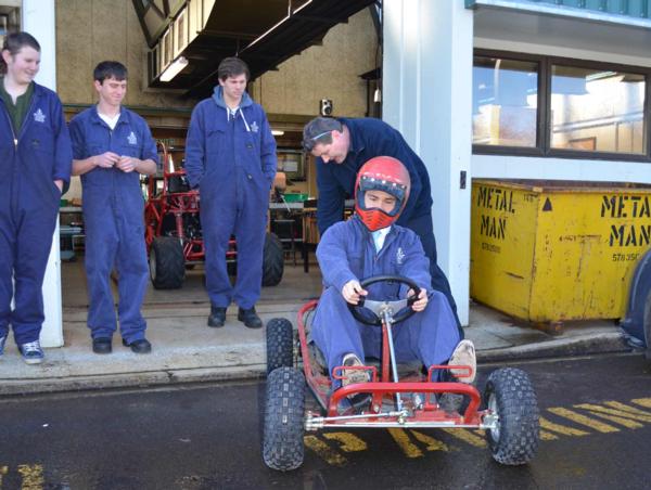 Simon takes the go-kart for a spin.