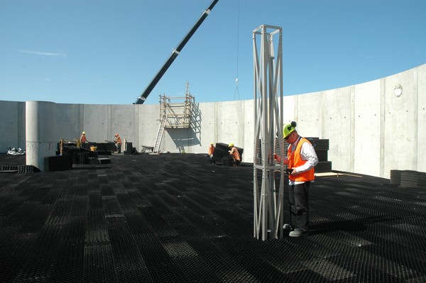 Gisborne District Council project engineer Michael Yukich looks down the shaft which enables sections of plastic media to be removed for inspection within the biological trickling filter tank. Screened wastewater will be pumped up the central column (left