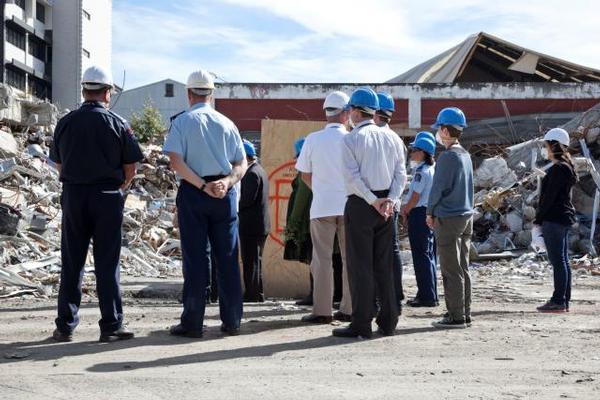  Rev Maurice Gray (centre, in orange hard-hat) and Rev Jim Patrick (at right), with representatives of iwi and emergency services, conducting a blessing at the PGC building site.