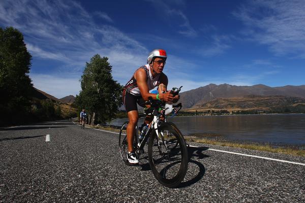 Manu Clarkson of Christchurch competes in the bike leg during Challenge Wanaka on January 21, 2012 in Wanaka, New Zealand.