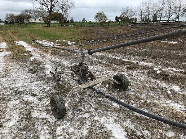 Irrigator stationary in paddock.