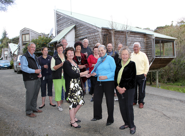  Sue Hodge, left, hands keys to the council's Russell pensioner units to Lorraine Young.  