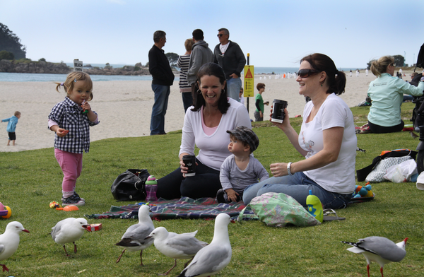 Families are already flocking back to the Mount Maunganui main beach to enjoy the fine weather while beach clean up crews work with the expectation that the beach can be open for the long weekend.