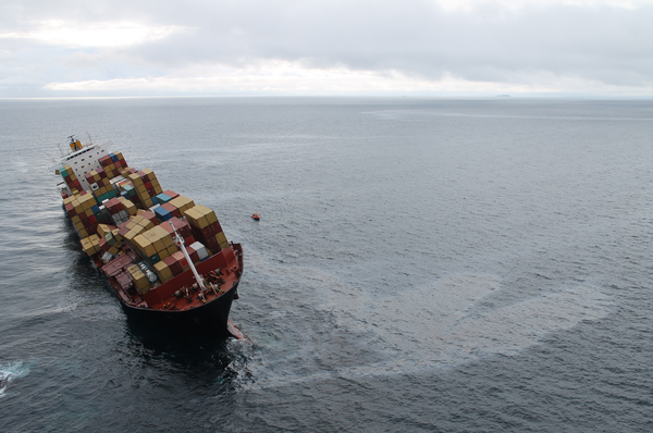 Arial shot taken in the morning showing a sheen of oil that had leaked from the Rena overnight.