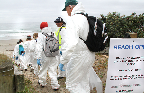 Volunteer teams head out to start clean up work at Tay St, Mt Maunganui