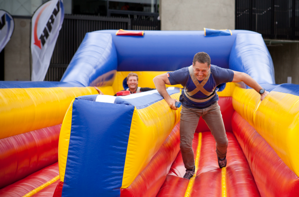 Marc Ellis challenges BLACKCAP Martin Guptill on a horizontal bungee at HRV Sponsorship Day.