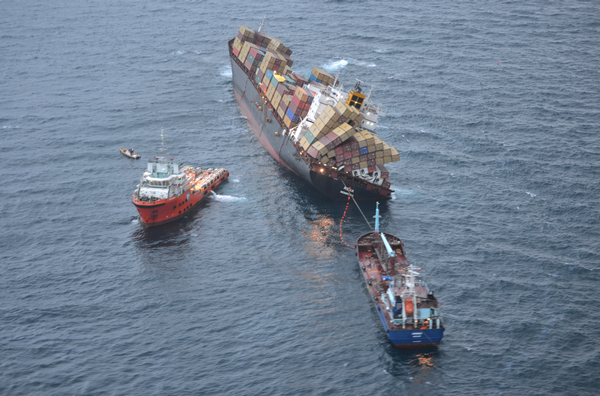 The completed helicopter platform above bay 32 forward of the superstructure, and the offloading vessels &#8211; the Go Canopus and the Awanuia at Rena's stern