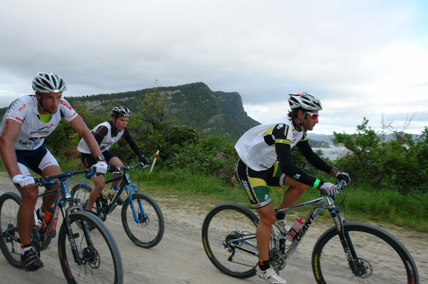 Richard Ussher, Trevor Voyce and Team Jam Sohn (Sam Clark & John Gray) battling it out with lake Waikaremoana in the background.  Trevor overtook Richard some 6 hours later in the mountains visible in the distance, the Panekire Rangers.