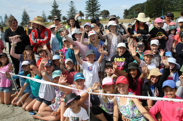 Onlookers watch excitedly watch the first batch of cleaned penguins being released at Mt Maunganui.