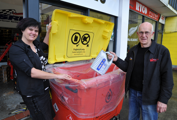 Auckland Council Waste Minimisation Project Advisor Sandi Murray and Segedins Auto Spares Co-director Ivan Segedin Sr with the oil recovery bin now available at the Dominion Road store.