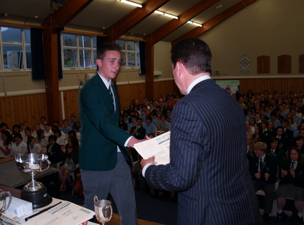 QCC NZ King Salmon Scholarship recipient Brook Lines receives his award from NZ King Salmon CEO Grant Rosewarne.